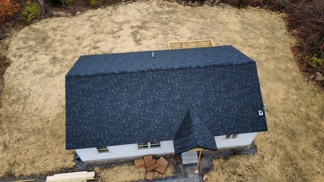 Architectural shingle roof installation drone view in Maine