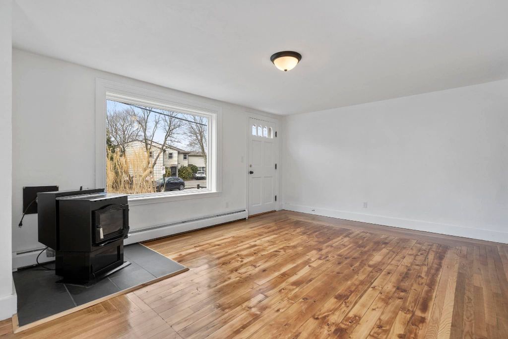 Living room renovation with hardwood floors in Southern Maine