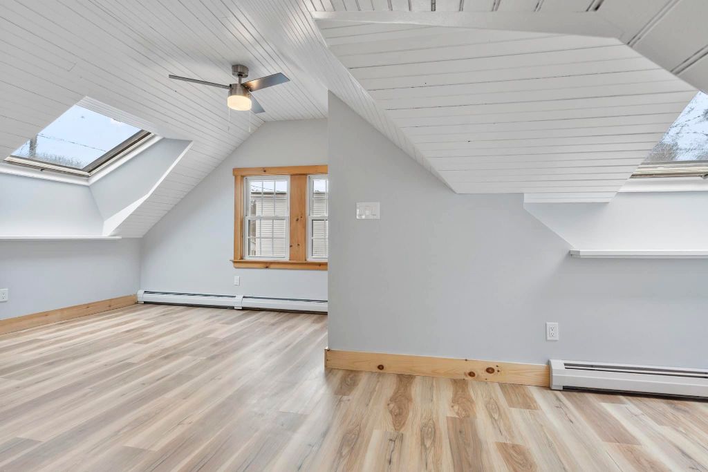 Second story home addition with vaulted ceilings and skylights in Maine